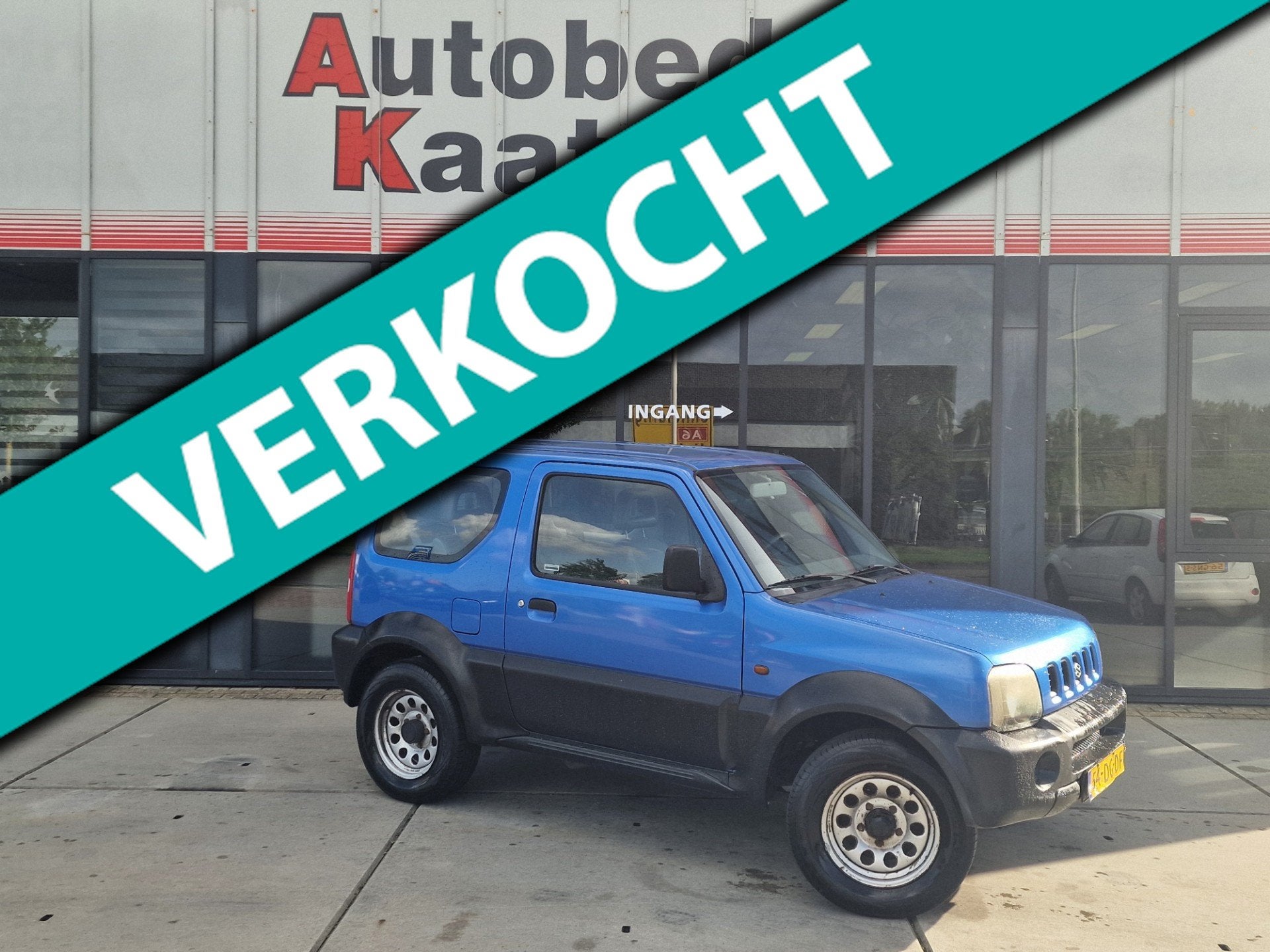 Suzuki Jimny 1.3 JX 4WD Trekhaak, Auto's, Euro 2, Zwart, 4 cilinders, Leder en Stof
