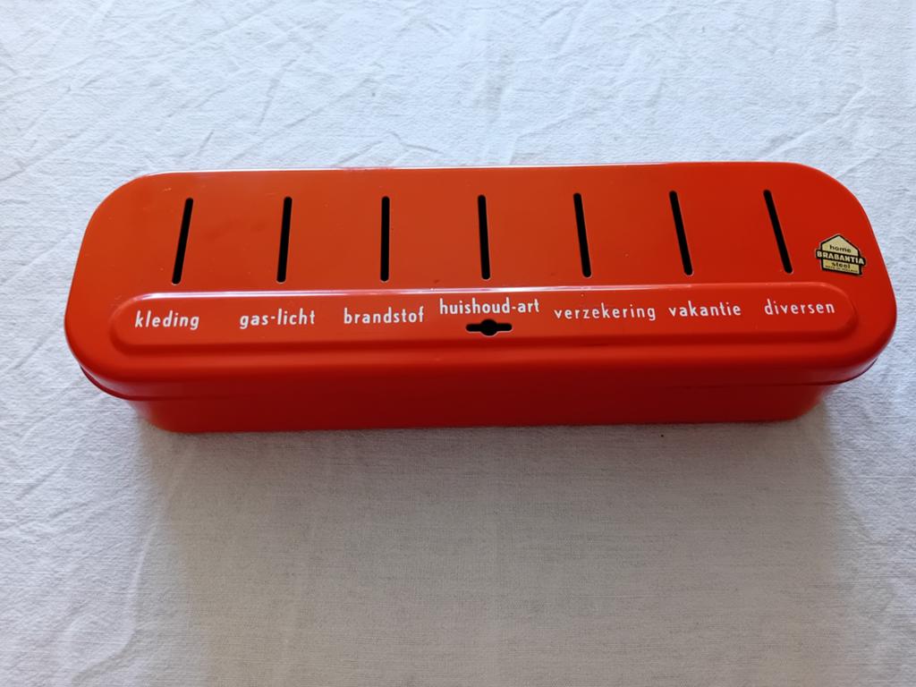 Vintage Brabantia spaarpot - oranje emaille, Ophalen of Verzenden, Gebruikt, Metaal of Blik, Overige thema's