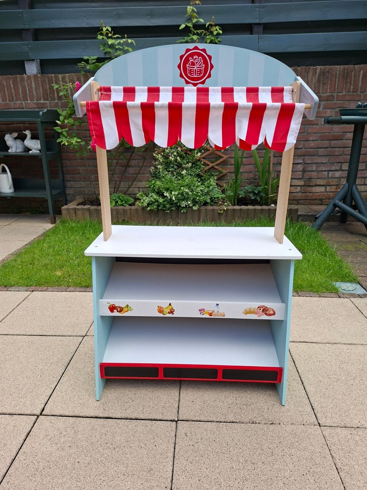 Kinder winkeltje / Kinder theater., Ophalen
