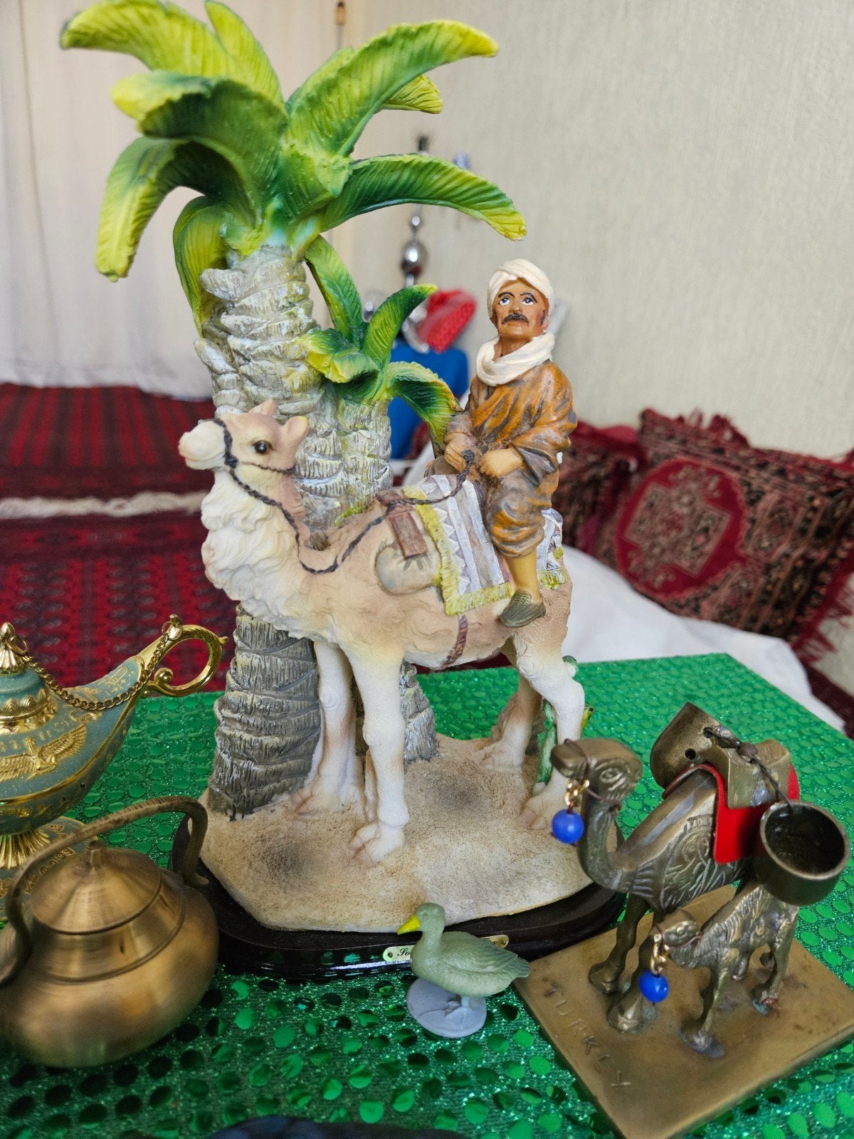 Decoratief beeldje: Kameel met ruiter onder palmboom, Ophalen