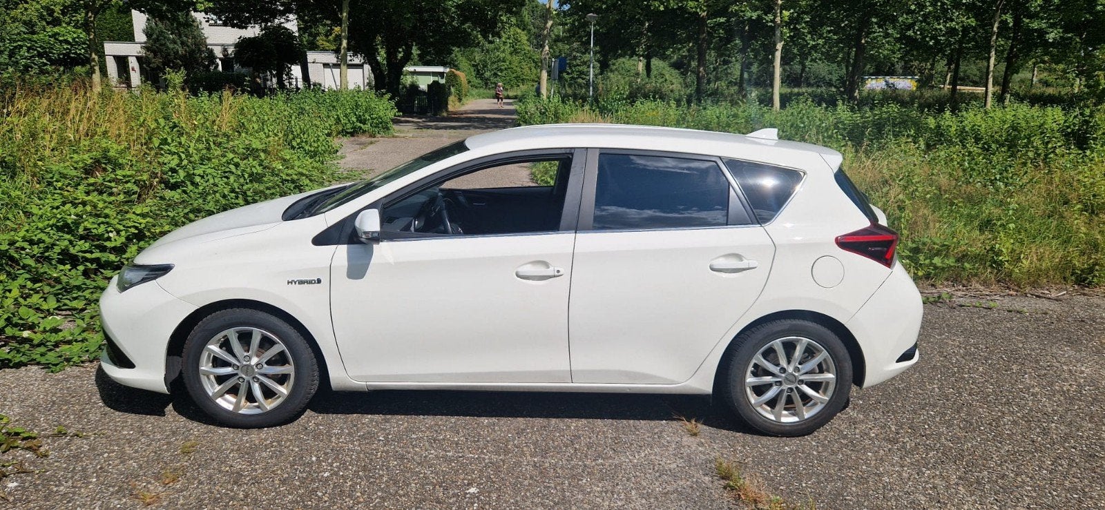 Toyota Auris 1.8 Hybrid 136pk Aut 2018 Wit, Auto's, Stof, Zwart, 4 cilinders, Wit