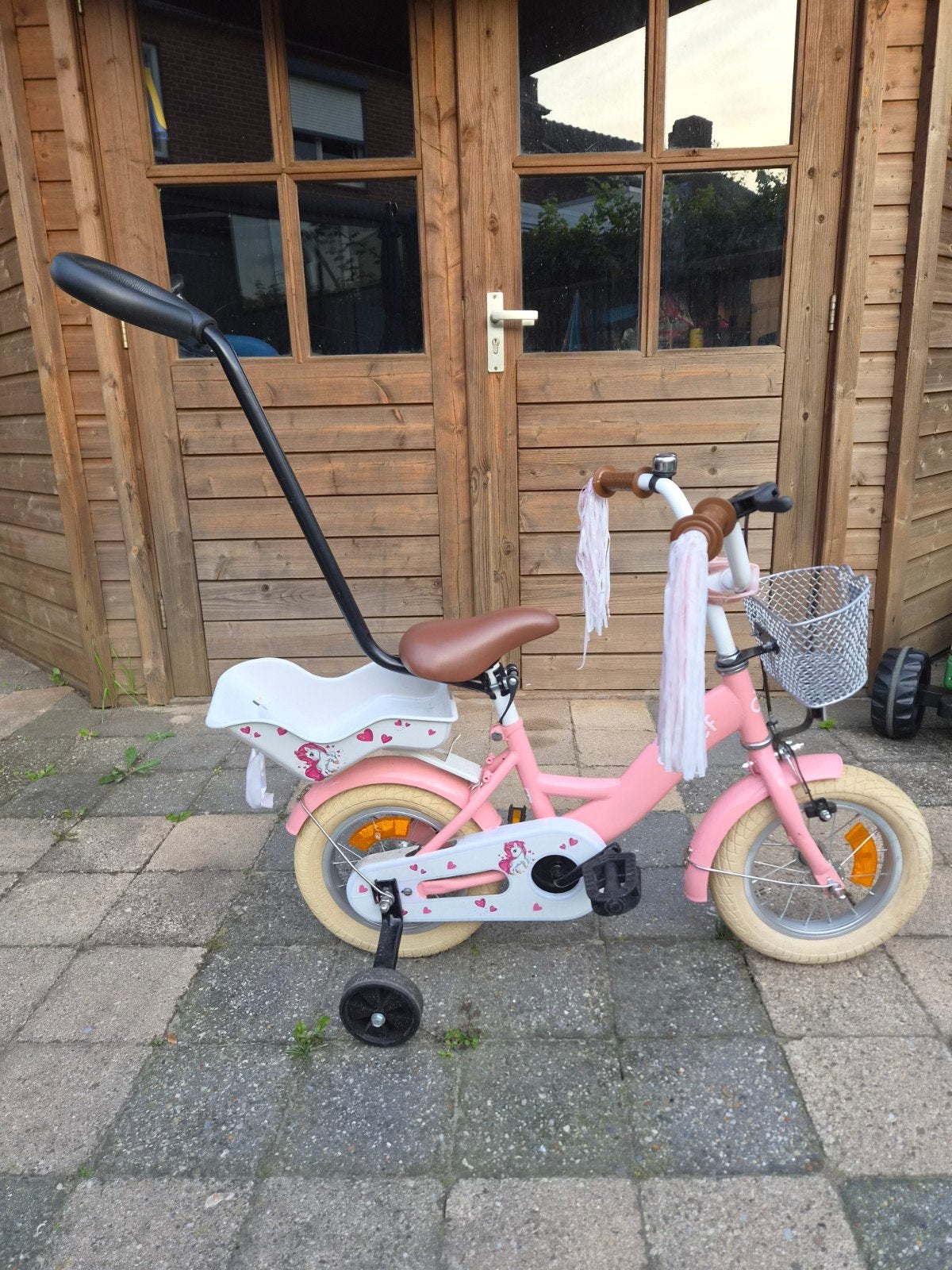 Roze kinderfiets Sjoef met zijwieltjes en duwstang, Fietsen en Brommers, Ophalen, Terugtraprem, Zijwieltjes, Gebruikt