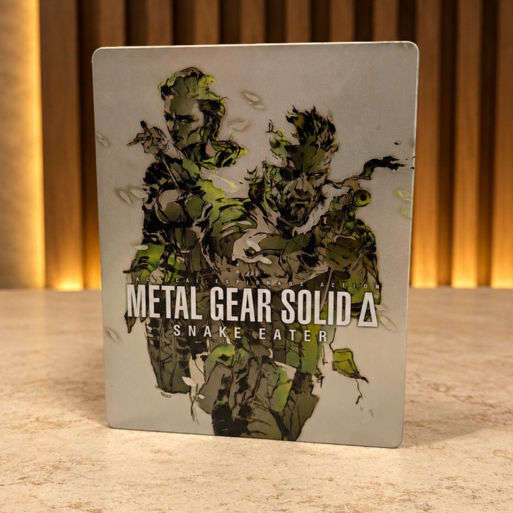 Metal Gear Solid Delta: Snake Eater - Deluxe Edition, Sony, Zo goed als nieuw, Support@sony.com, 1-7-1 Konan, Minato-ku
Tokyo 108-0075
Japan