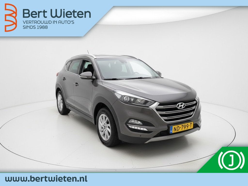 Hyundai Tucson 1.6 GDi Go! | Geen import | Trekhaak | Camera, Auto's, Stof, Gebruikt, 4 cilinders, Bruin