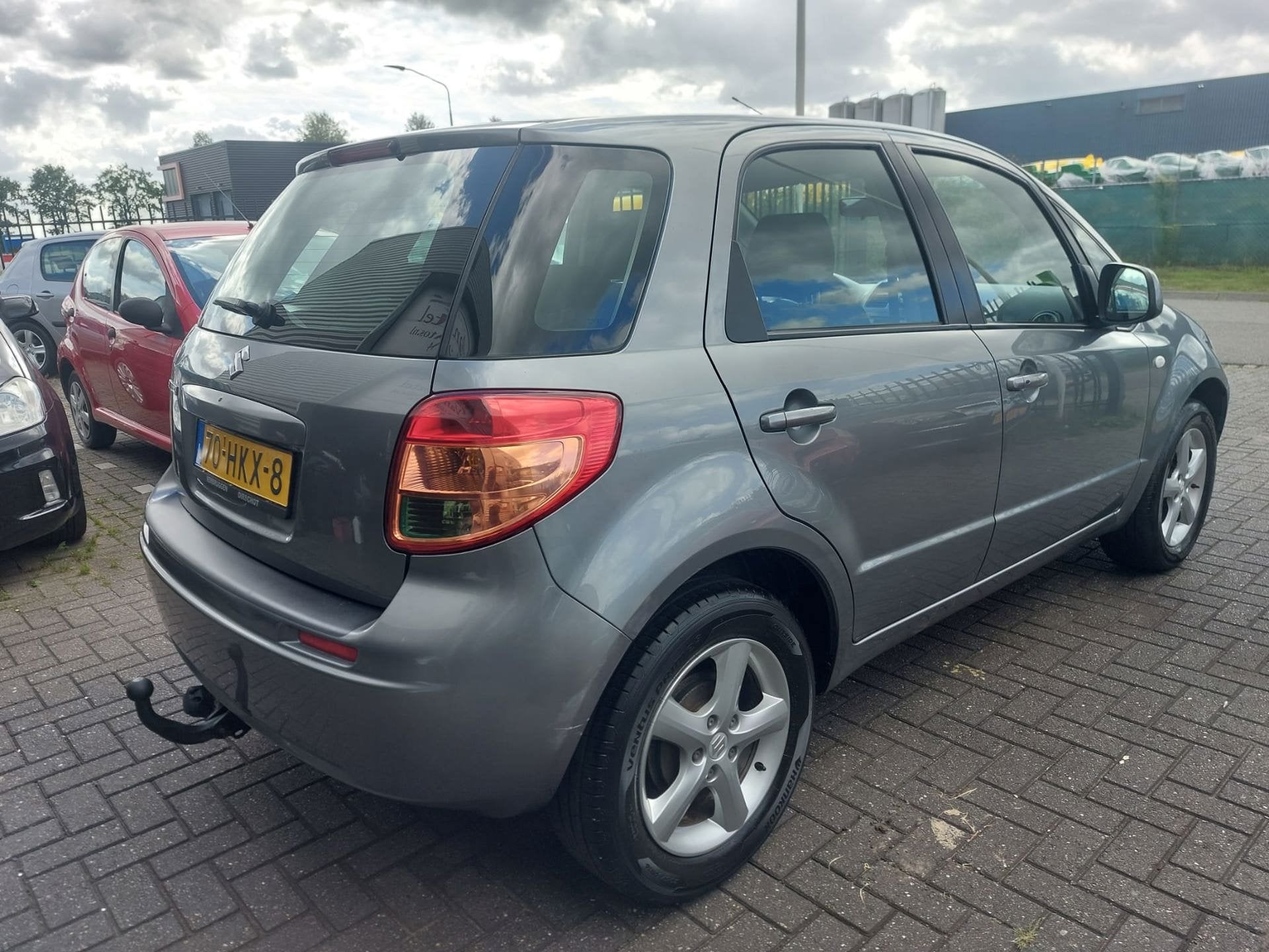 Suzuki SX4 1.6 Exclusive 5 deurs + geregelde airco, Voorwielaandrijving, Gebruikt, Metallic lak, 4 cilinders