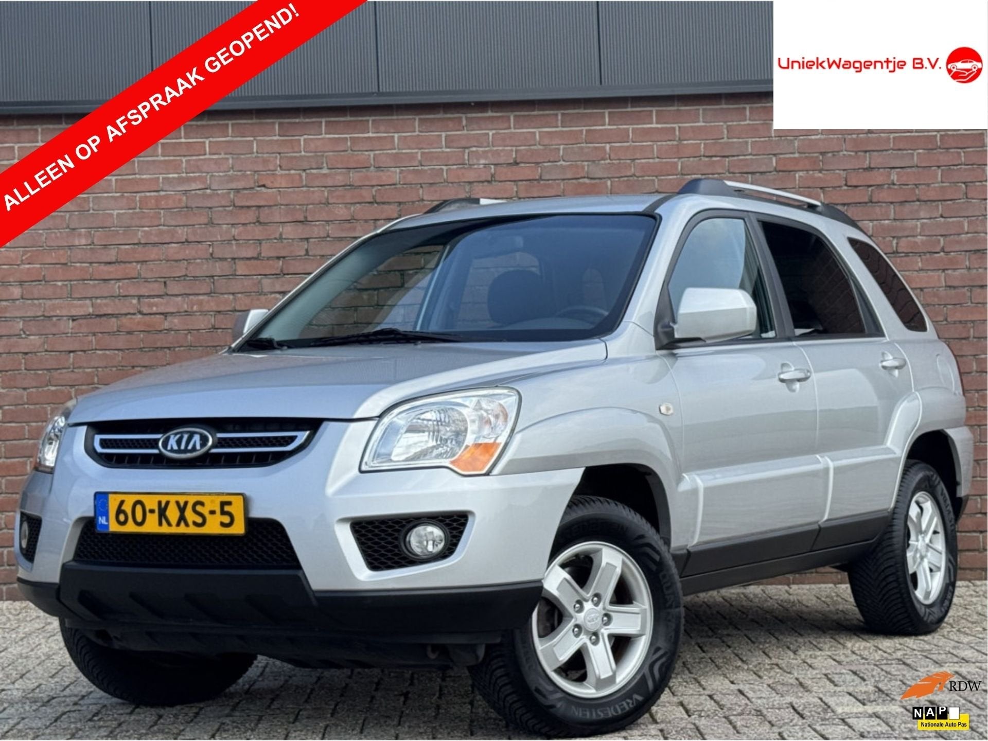 Kia Sportage 2.0 CVVT X-TRA | NL-AUTO! | CRUISE! | TREKHAAK!, Auto's, 1442 kg, Stof, Gebruikt, Zwart