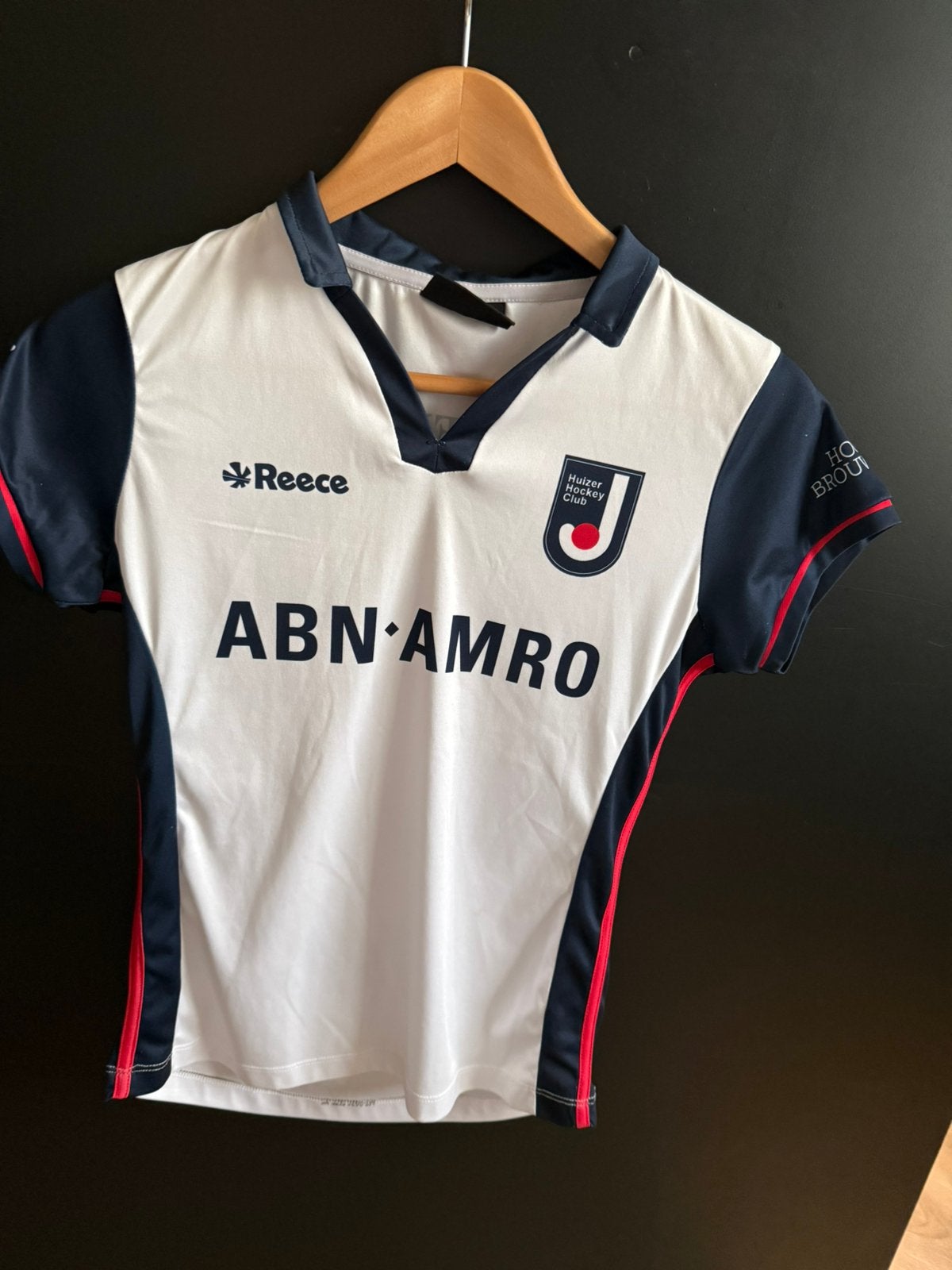 Huizer Hockey meisjes thuis shirt XS, Ophalen, Zo goed als nieuw, Kleding
