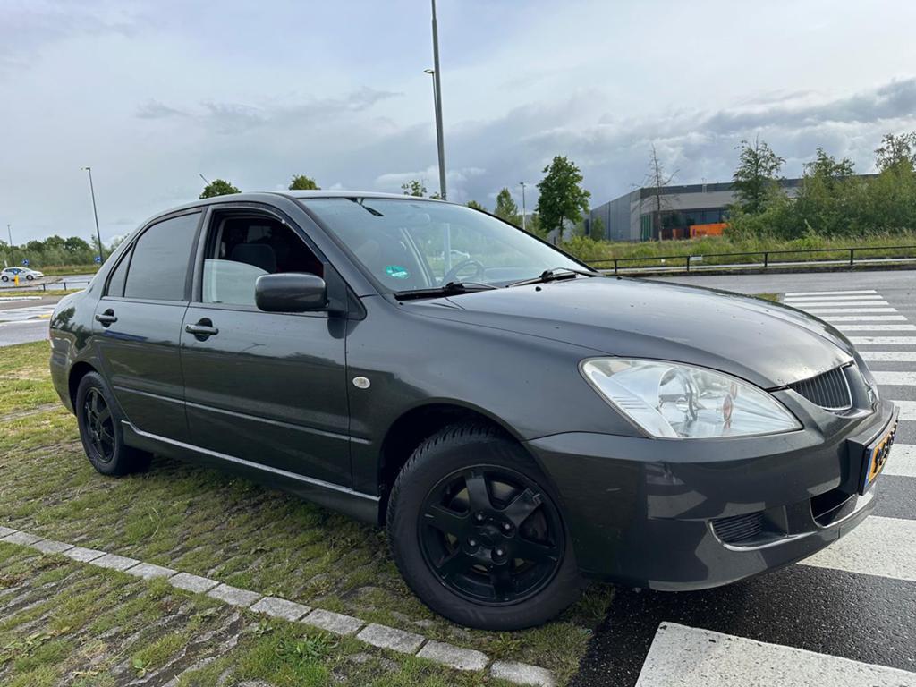 Mitsubishi Lancer 1.6 2005 Grijs Unique! Nap, Auto's, Mitsubishi, Voorwielaandrijving, 1160 kg, Zwart, 4 cilinders