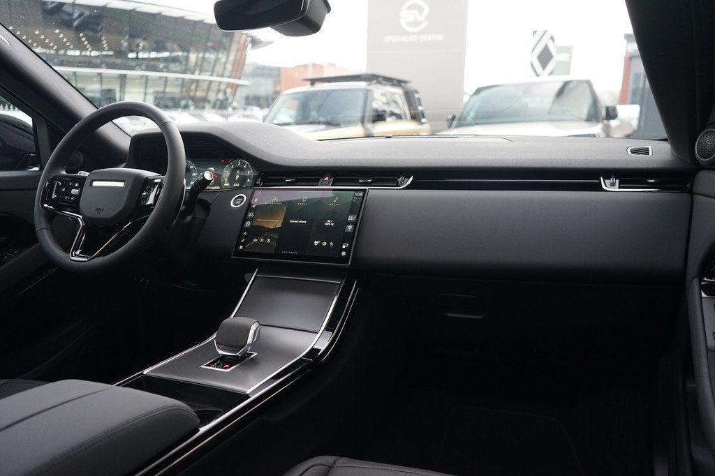 Land Rover Range Rover Evoque P270e PHEV AWD Business Editio, Auto's, Land Rover, 12 maanden, 1498 cc, Zwart, Zwart