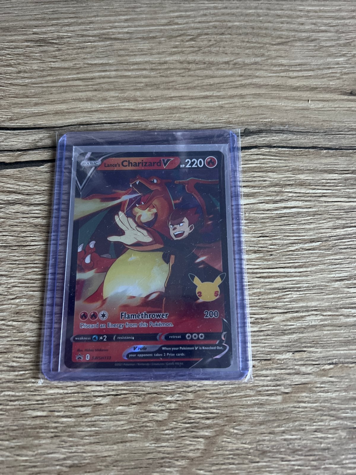Lance's Charizard V Pokémon kaart (Celebrations), Ophalen, Zo goed als nieuw, Losse kaart