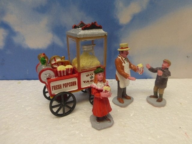 lemax popcorn seller kerstdorp poppetjes figurines kraampje, Ophalen of Verzenden, Zo goed als nieuw
