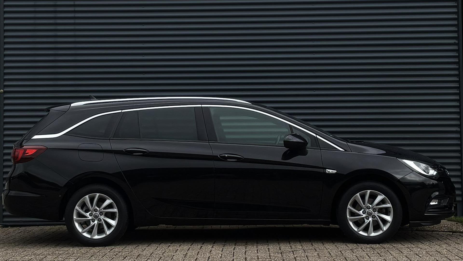 Opel Astra Sports Tourer 1.4 Turbo 150pk, Auto's, Parkeersensor, Gebruikt, Euro 6, 4 cilinders