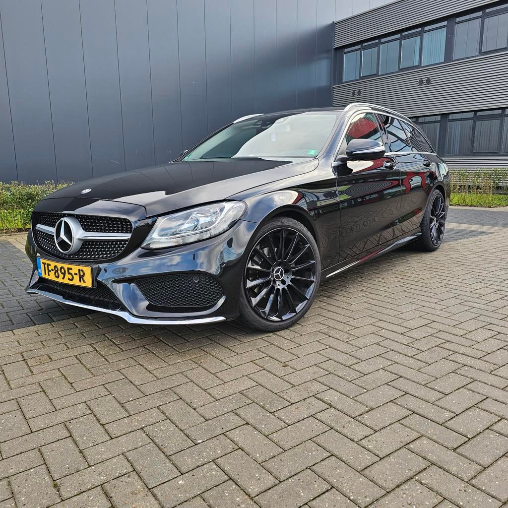 Mercedes-Benz  AMG line C180 1.6 115KW Estate 2015 Zwart, Auto's, Achterwielaandrijving, 1370 kg, Leder en Stof, Zwart