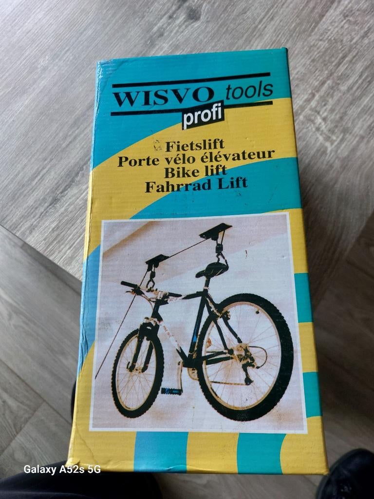 Fiets lift ophangsysteem., Ophalen