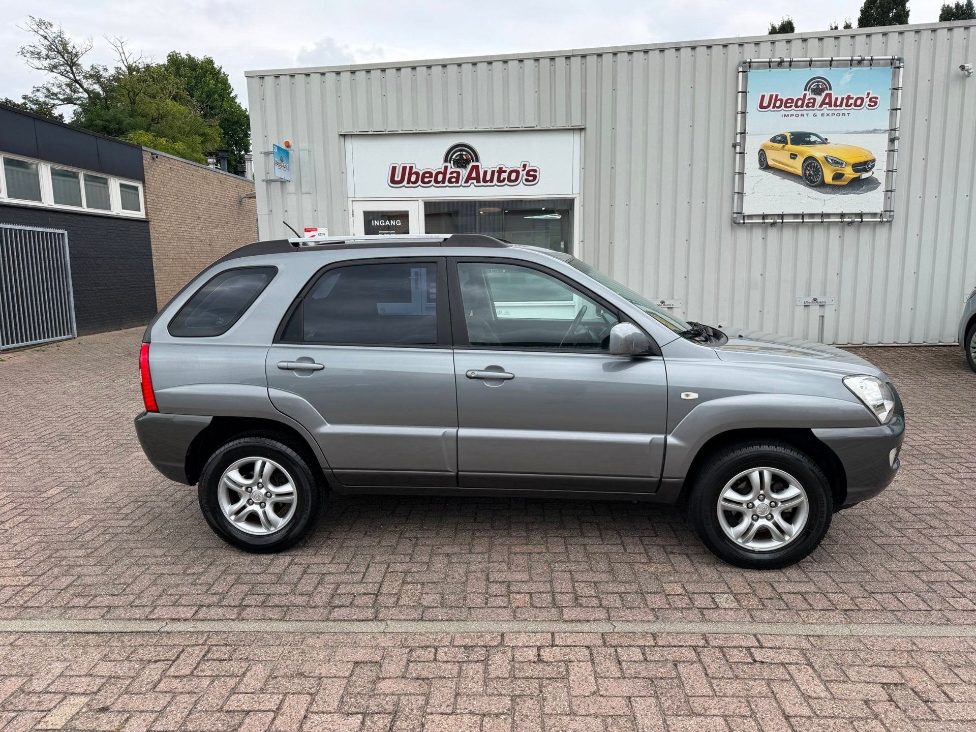 Kia Sportage 2.0 CVVT Comfort NL AUTO 2450E, 1442 kg, Stof, Gebruikt, 4 cilinders