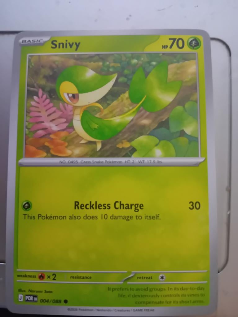 Pokémon Kaart: Snivy (004/088) - Basic HP70, Ophalen of Verzenden, Zo goed als nieuw, Losse kaart, Foil