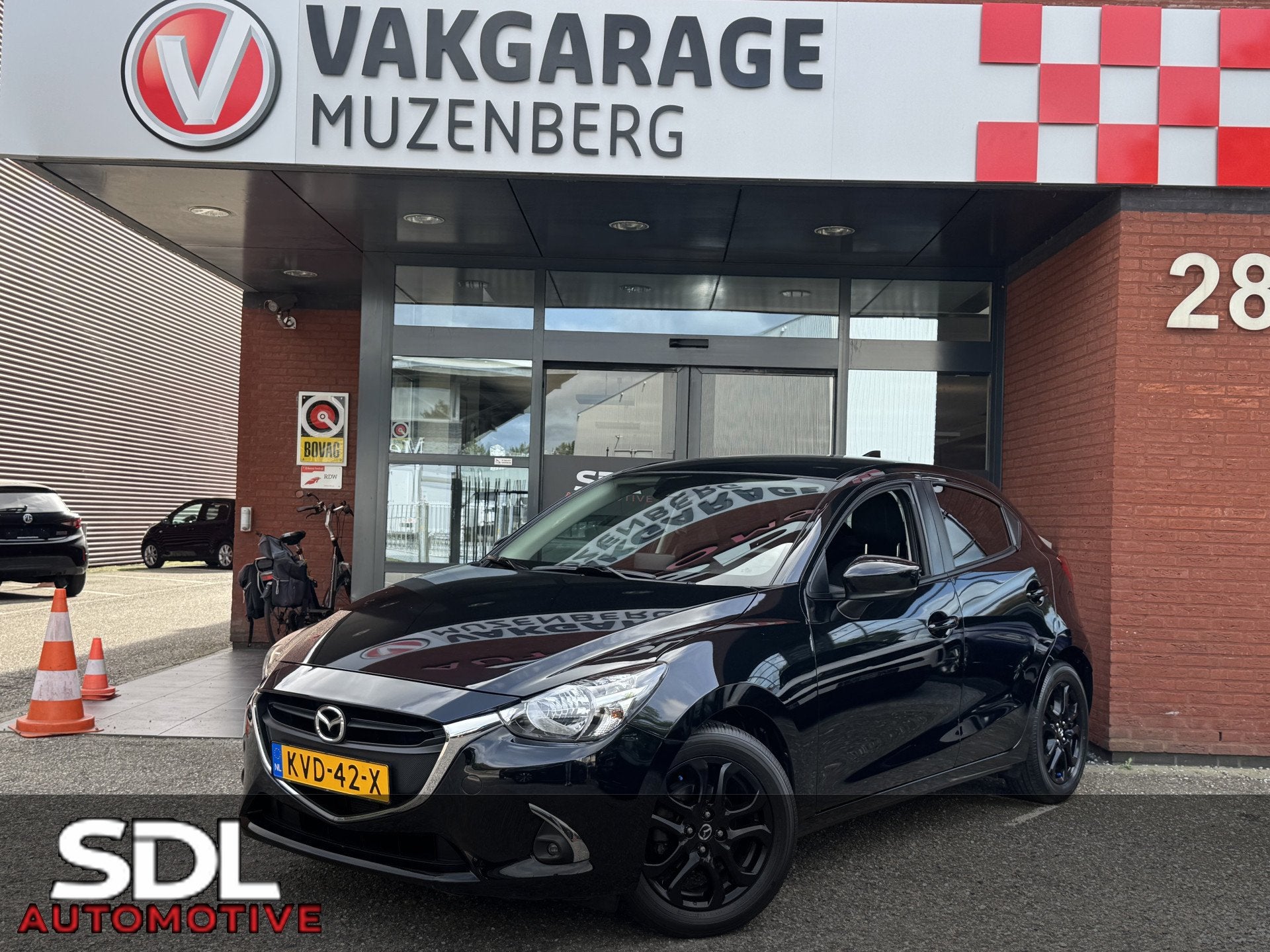 Mazda 2 1.5 Skyactiv-G TS+ // DEALER ONDERHOUDEN! // NAVI //, Auto's, Voorwielaandrijving, Gebruikt, Zwart, 4 cilinders