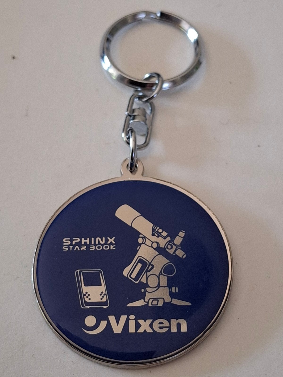 Vixen astronomische telescopen sleutelhanger, Ophalen of Verzenden, Zo goed als nieuw