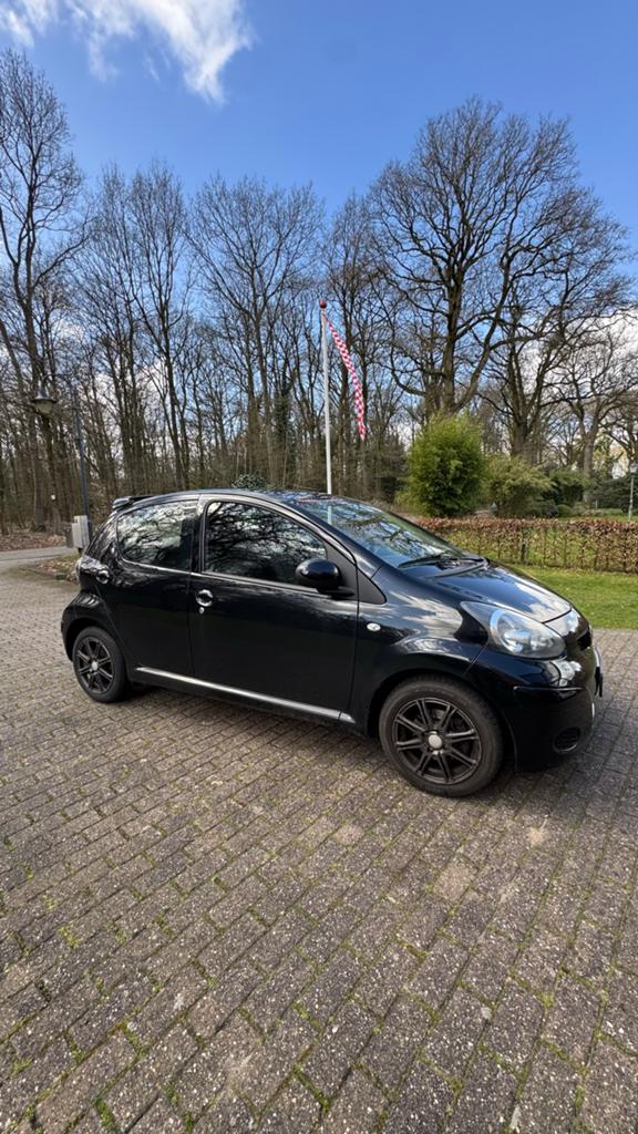 Toyota Aygo 1.0 12V Vvt-i 5DRS 2009 Zwart, Voorwielaandrijving, Stof, Zwart, 4 stoelen