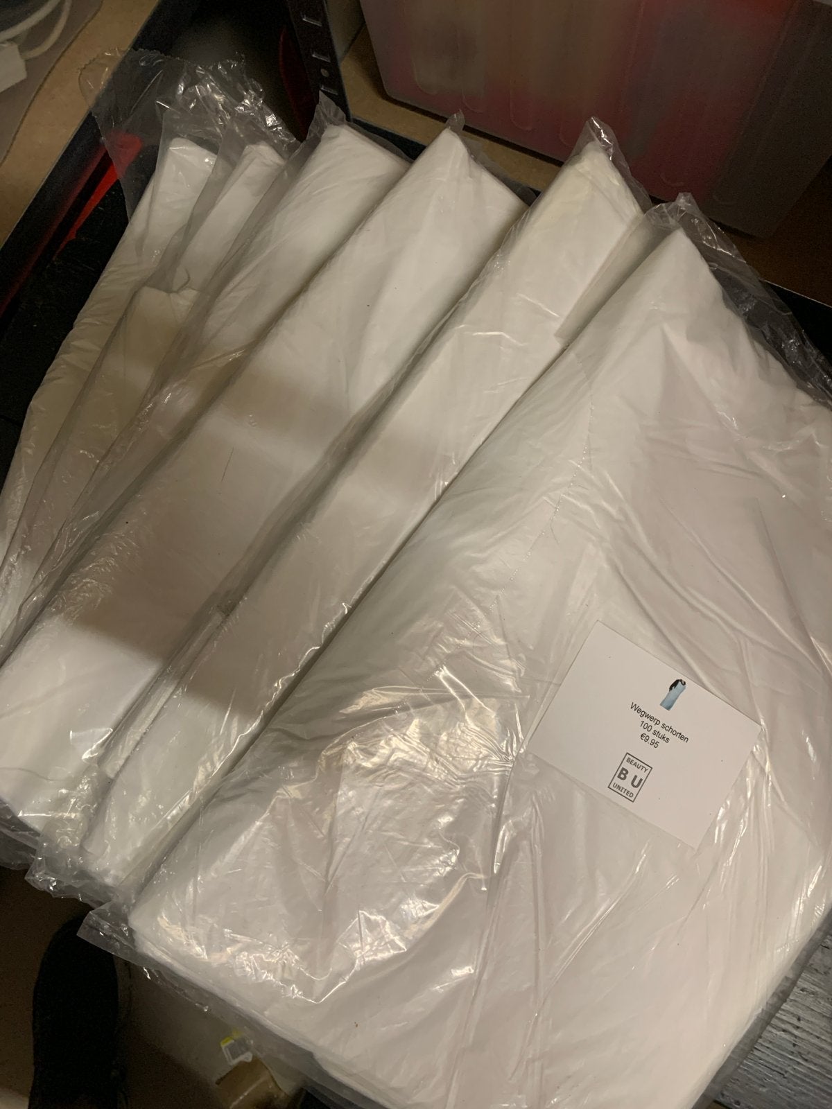 6x100 wegwerpschorten wit plastic schorten 600 stuks, Ophalen of Verzenden