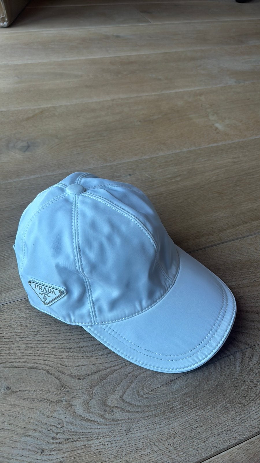 Prada pet wit, Kleding | Heren, Ophalen of Verzenden, Nieuw, One size fits all, Pet
