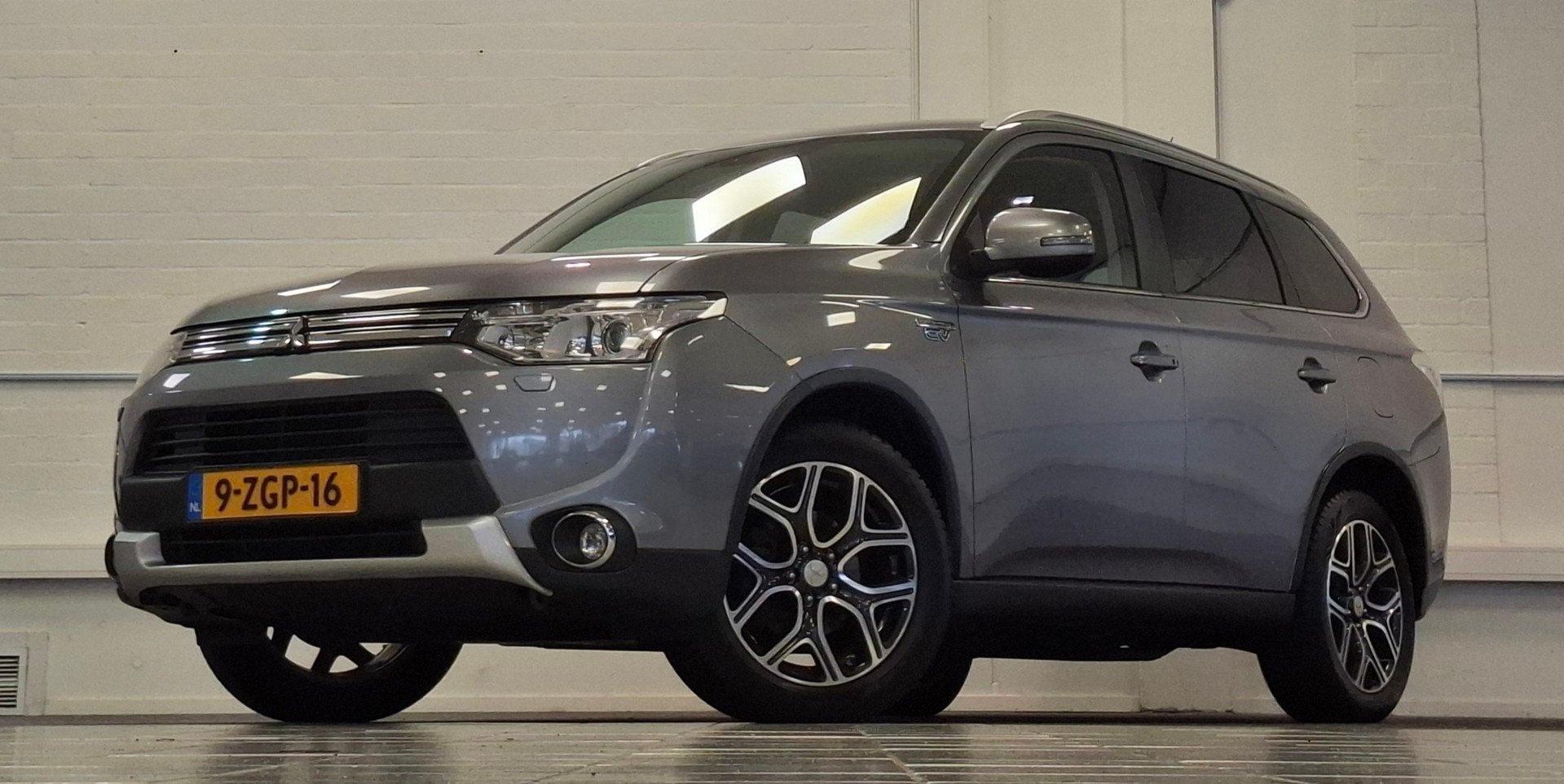 Mitsubishi Outlander 2.0 PHEV Executive X-Line 100% Onderhou, Auto's, Zwart, 4 cilinders, Leder en Stof, Bedrijf