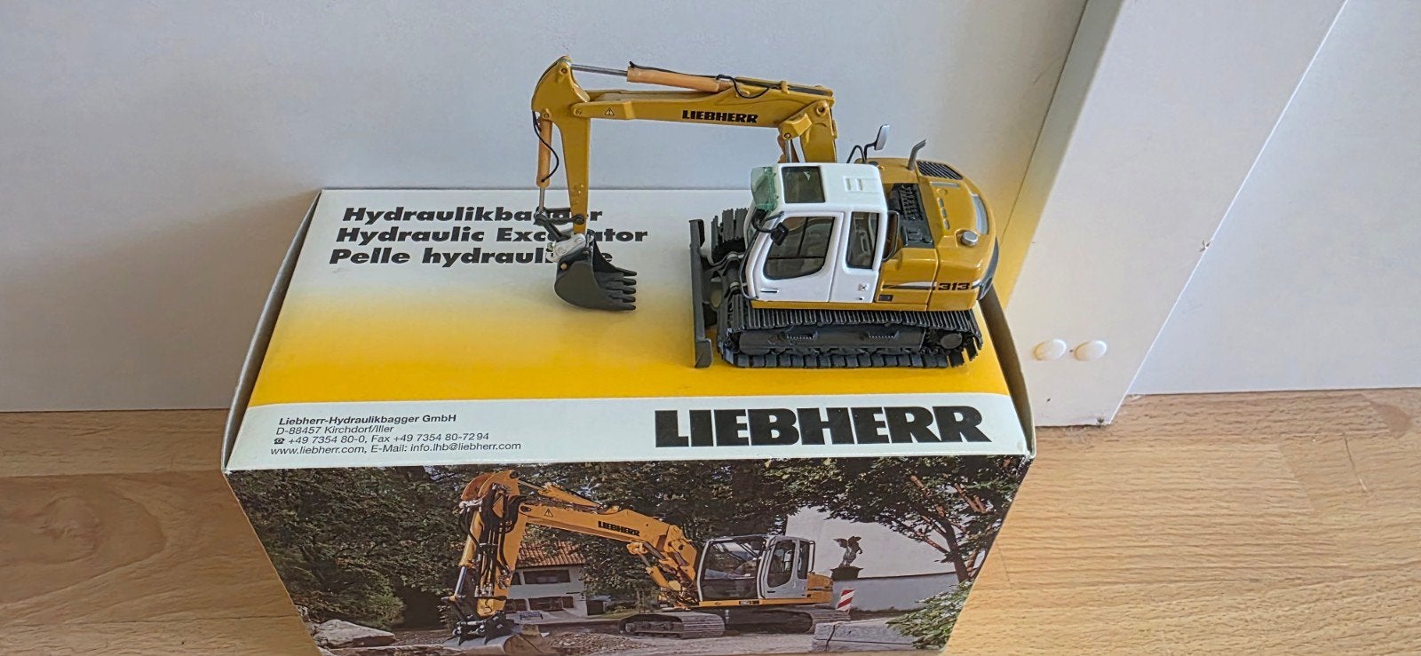 liebherr R313, Ophalen of Verzenden, Zo goed als nieuw, Hijskraan, Tractor of Landbouw, NZG