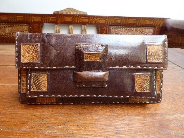 Vintage leren clutch met slangenleren details