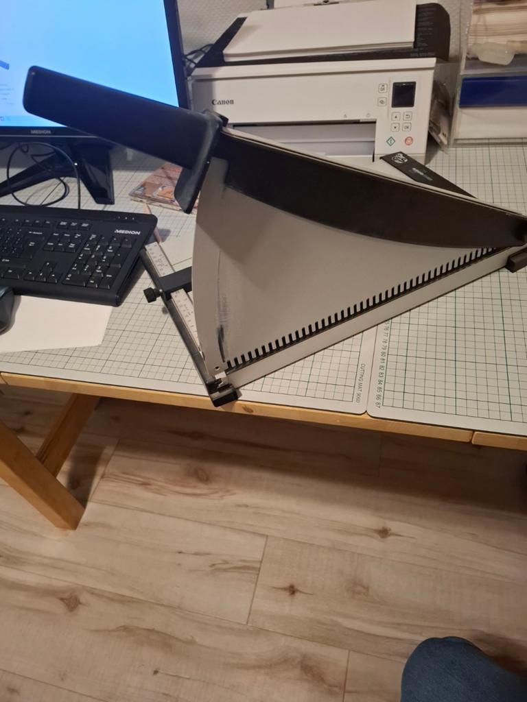 Argomes papiersnijder/snijmachine, Ophalen
