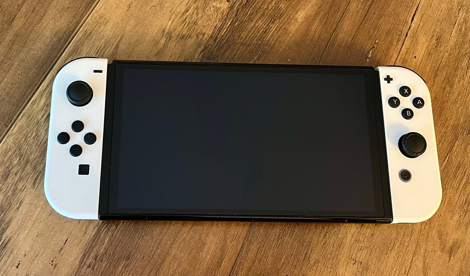 Foto 4 van Nintendo Switch OLED Wit + accessoires + 5 games