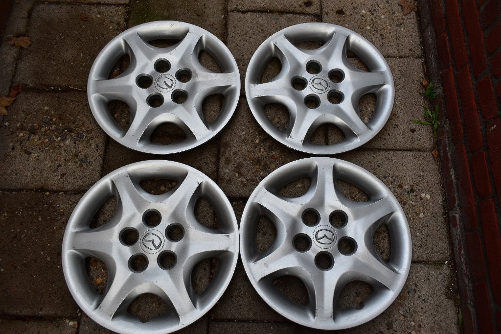 Set van 4 originele wieldoppen Mazda 626 15 inch, Auto diversen, Wieldoppen, Ophalen of Verzenden, Gebruikt