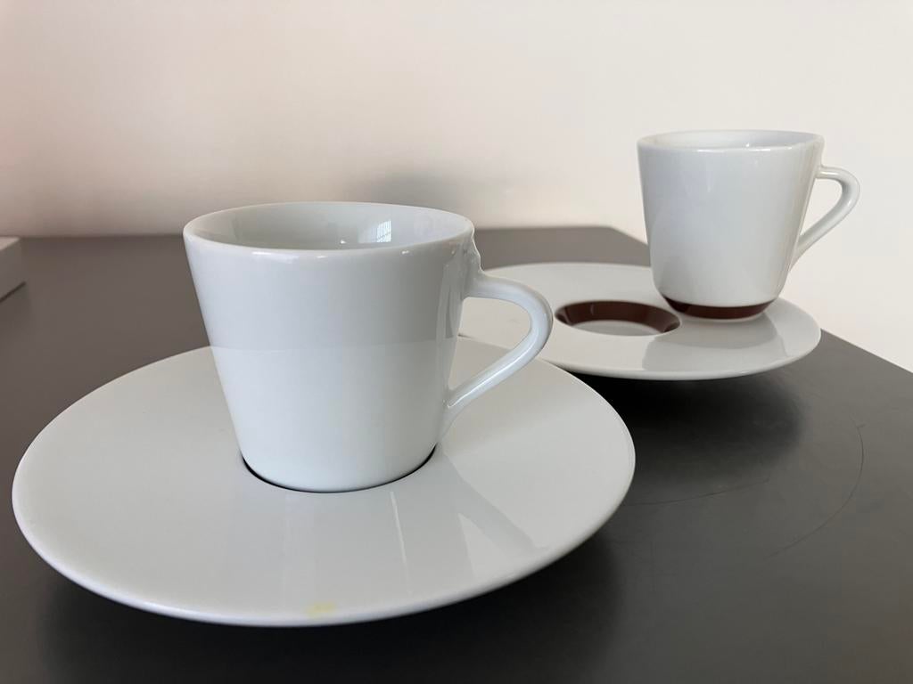 NESPRESSO kopjes 7x, Ophalen of Verzenden, Zo goed als nieuw, Porselein, Kop en/of schotel