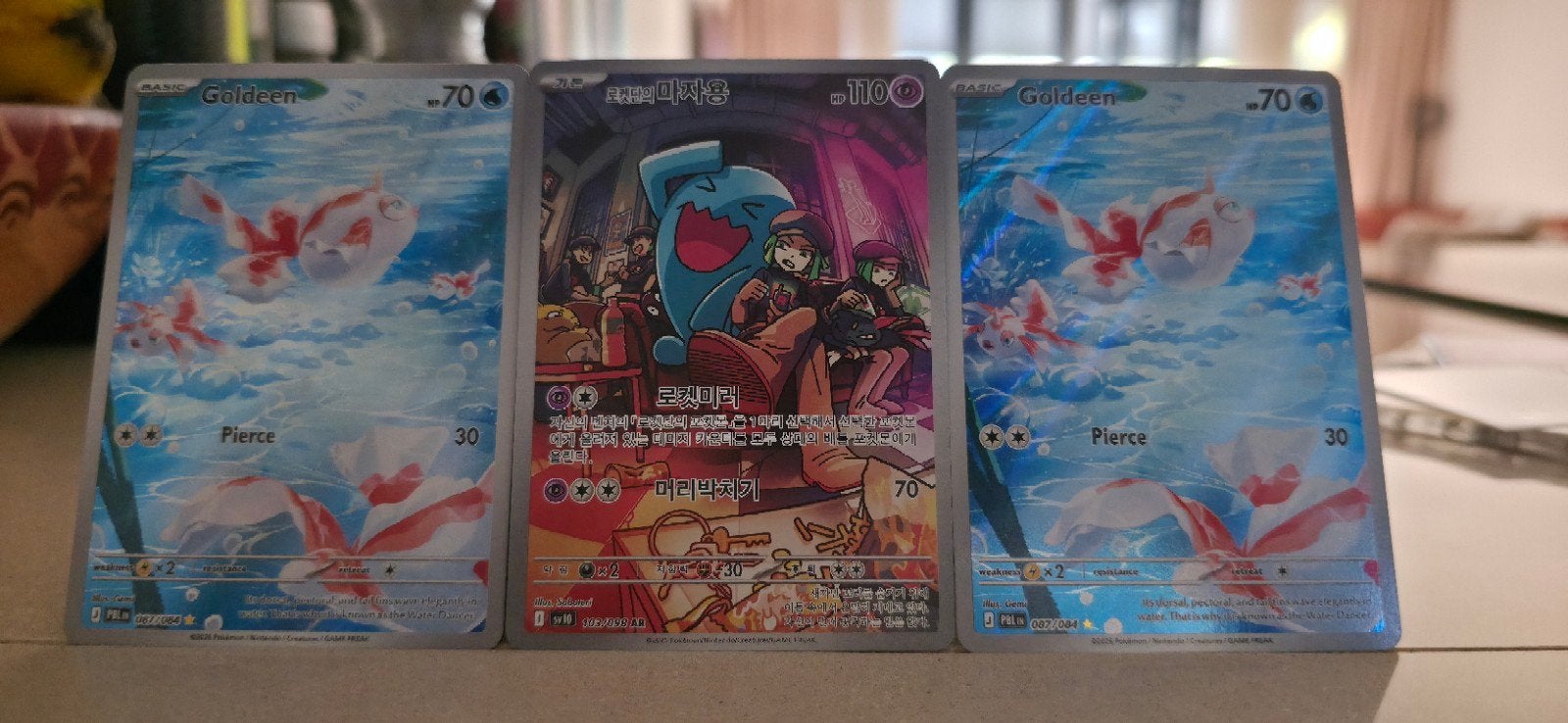 Pokémon 2x Goldeen Pitch Black, 1x Team Rockets Wobu, Ophalen of Verzenden, Zo goed als nieuw, Meerdere kaarten
