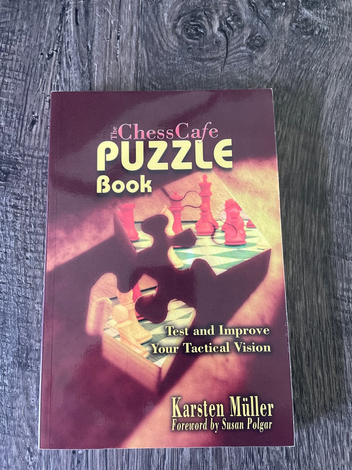 Schaakboek The Chess Cafe Puzzle Book - Karsten Müller, Boeken, Ophalen of Verzenden, Zo goed als nieuw