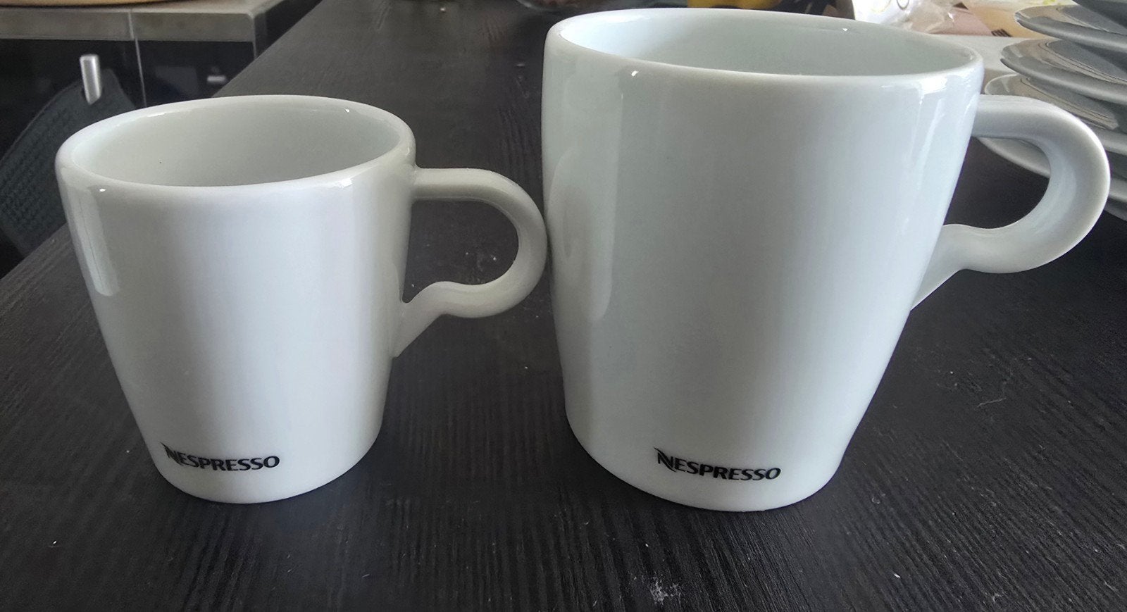 set 4x Nespresso kops en schotels, 2 lungo 2 espresso, Ophalen, Overige stijlen, Kop(pen) en/of Schotel(s), Glas