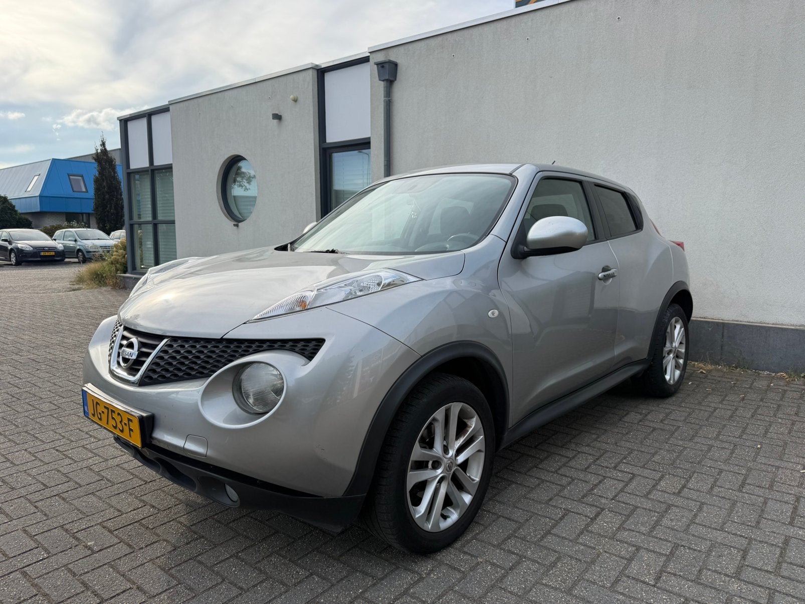 Nissan Juke 1.6 CVT 86KW AUT 2012 Grijs Cruise/Camera/Clima!, Stof, 1250 kg, Zwart, 4 cilinders