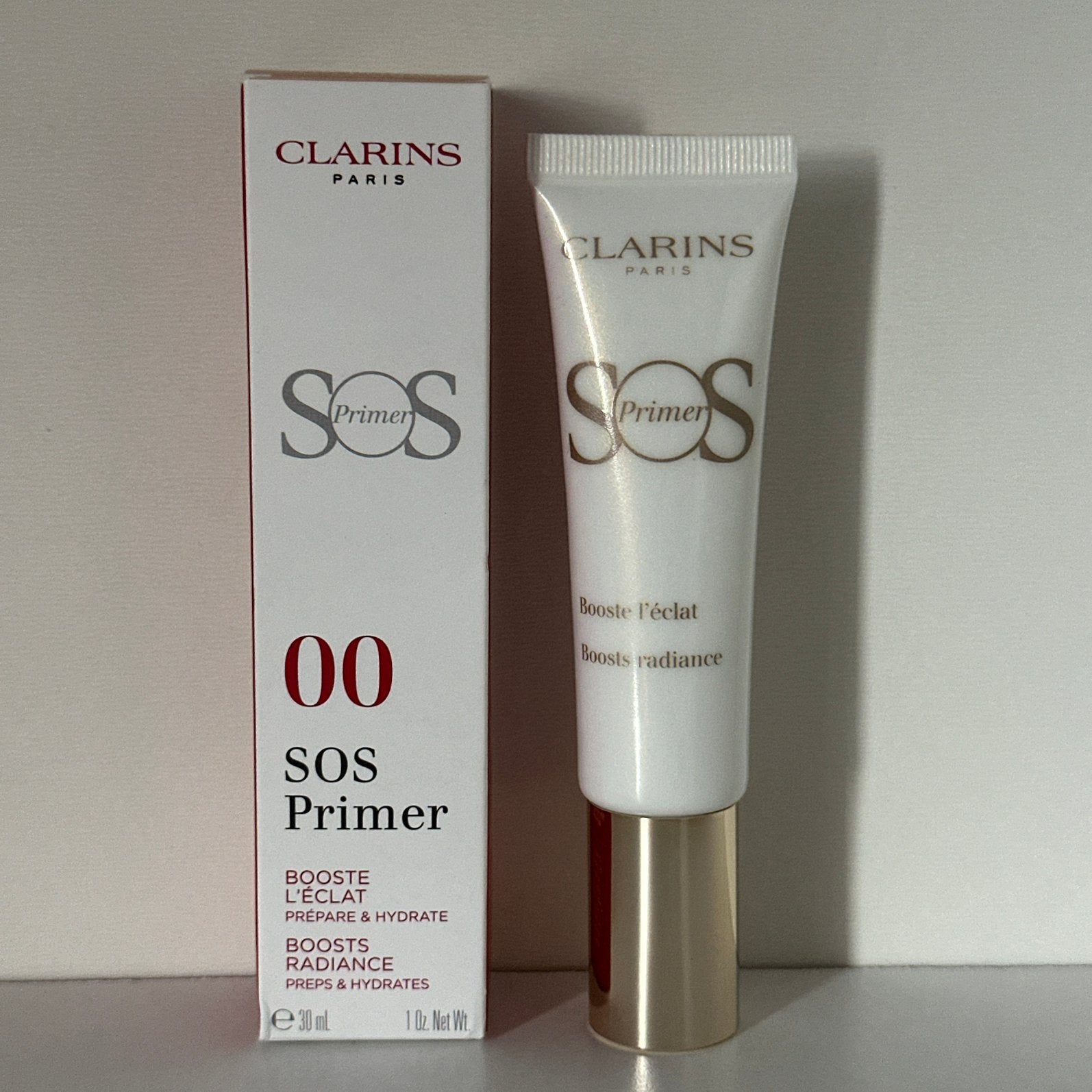 Clarins SOS Primer 30 ml #00 Universal Light#, Ophalen of Verzenden, Nieuw, Gehele gezicht, Verzorging