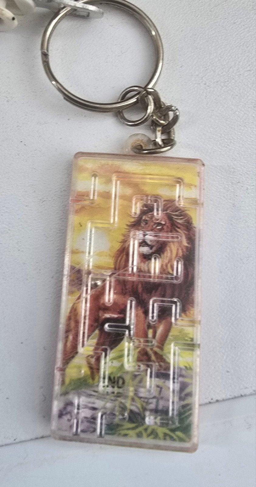 Sleutelhanger met leeuw en doolhof spelletje, Verzamelen, Sleutelhangers, Ophalen of Verzenden, Gebruikt, Dier of Natuur