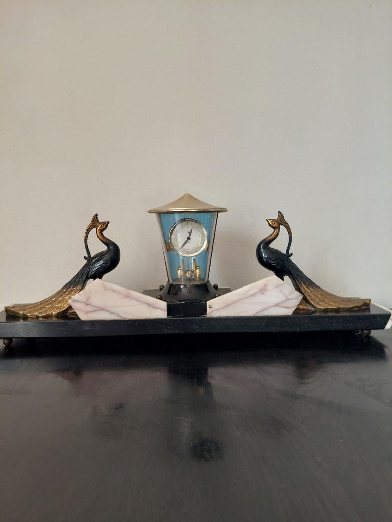 Art Deco marmeren klok, Ophalen