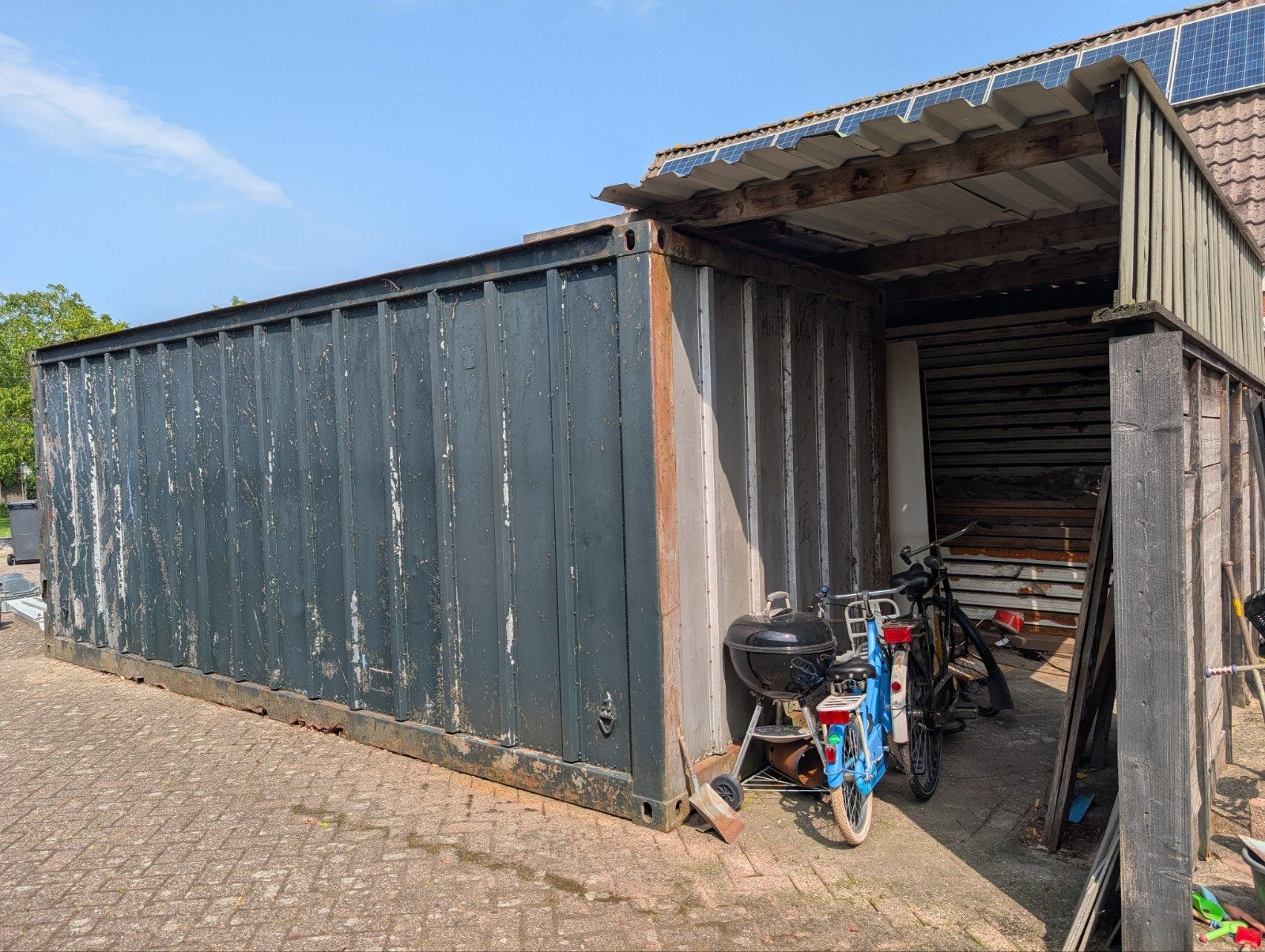 Zeecontainer met verstevigd dak en optionele golfplaten, Ophalen
