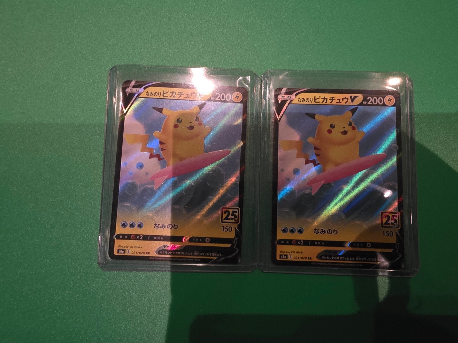 Surfing Pikachu V  021/028 25th, Ophalen of Verzenden, Zo goed als nieuw, Meerdere kaarten, Foil