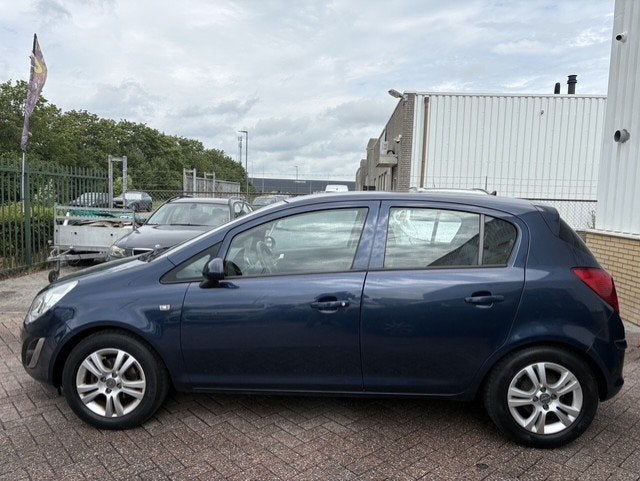 Opel Corsa 1.2-16V Design Edition, Auto's, Gebruikt, Zwart, 4 cilinders, Blauw
