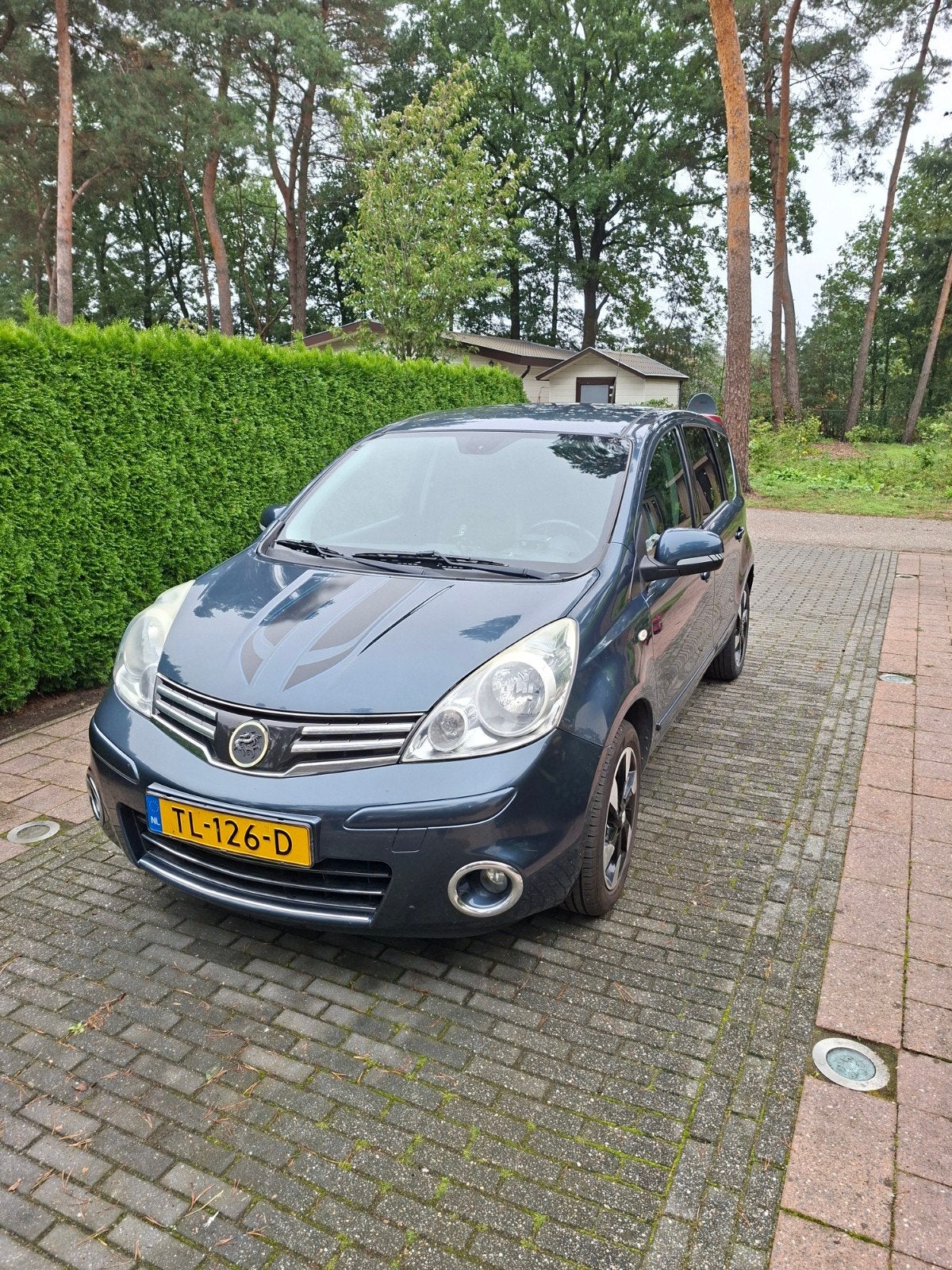 Foto 2 van nissan note 1.4 groen perfect onderhouden.