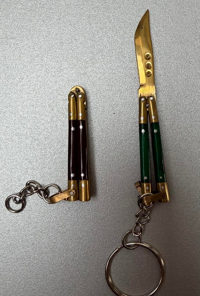 2 Butterfly knives keychain., Caravans en Kamperen, Kampeergereedschap, Ophalen of Verzenden, Zo goed als nieuw