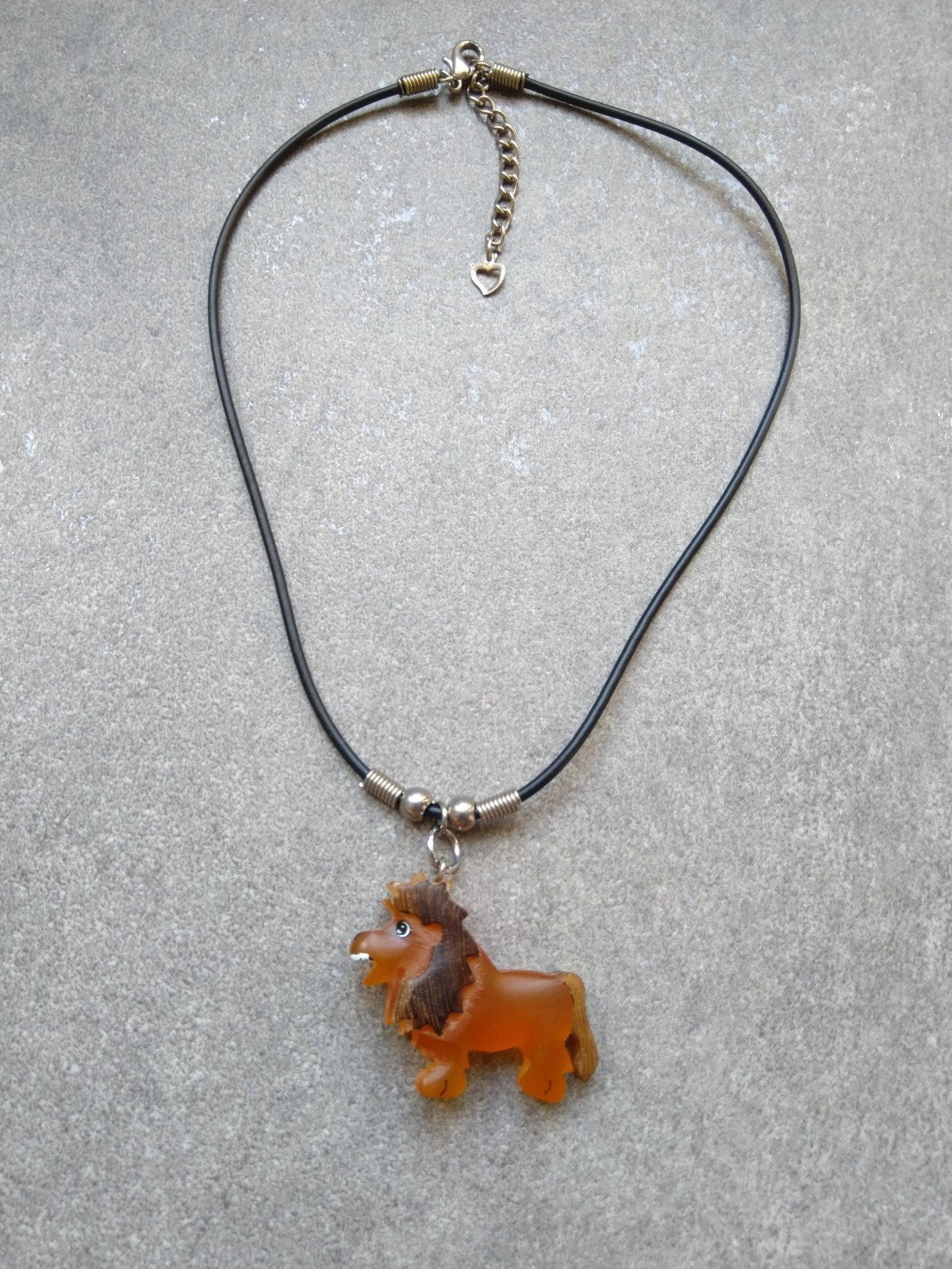 Kinderketting met een oranje leeuw eraan., Ophalen of Verzenden, Zo goed als nieuw, Oranje, Ketting