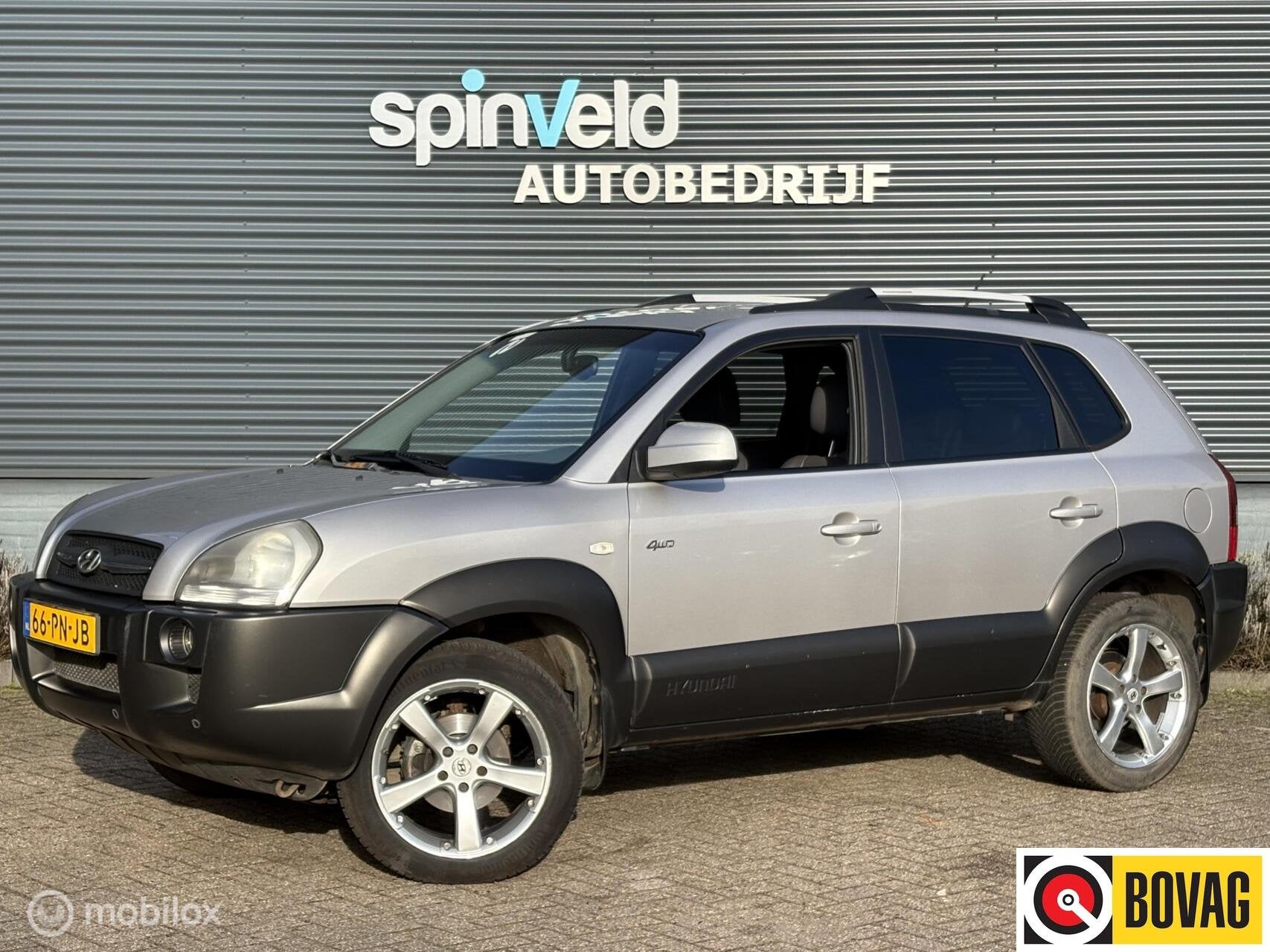 Hyundai Tucson 2.7i V6 4WD Style - Automaat - Climate - Nap, Auto's, Automaat, Gebruikt, 2656 cc, Bedrijf