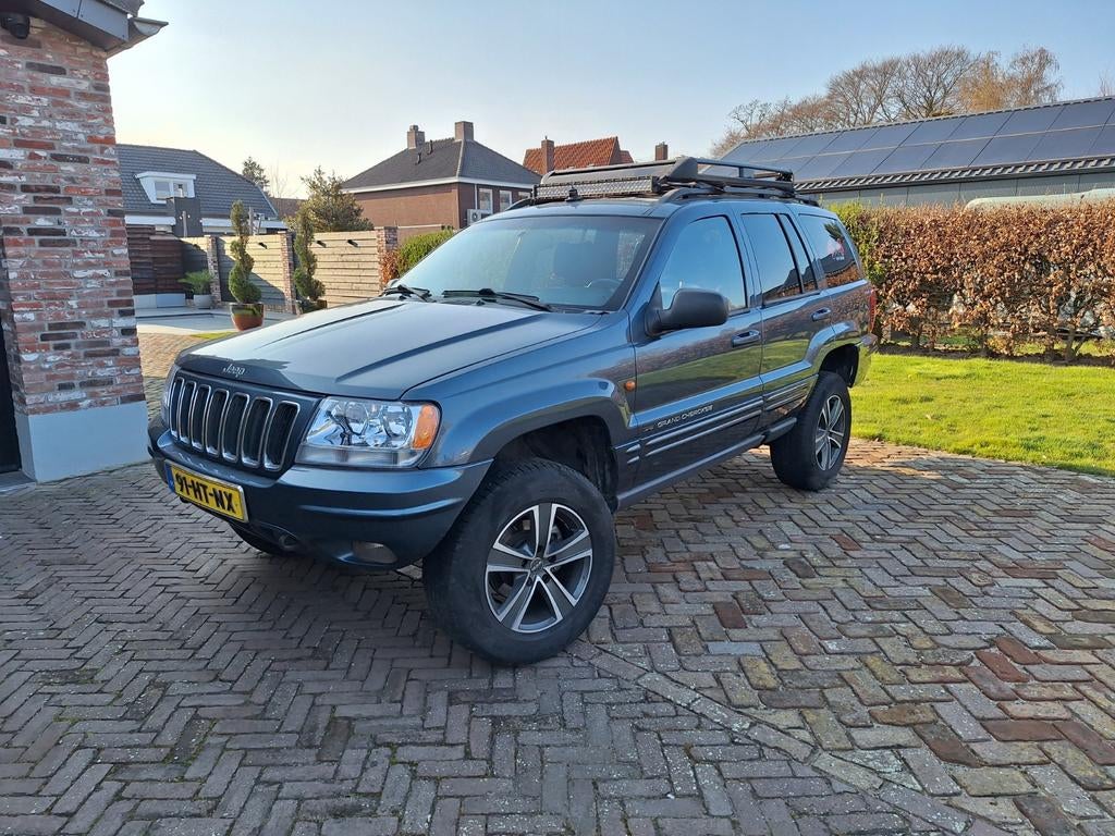 Jeep Grand Cherokee V8 4.7 automaat in goede staat, Auto's, Automaat, Blauw, Leder, Vierwielaandrijving