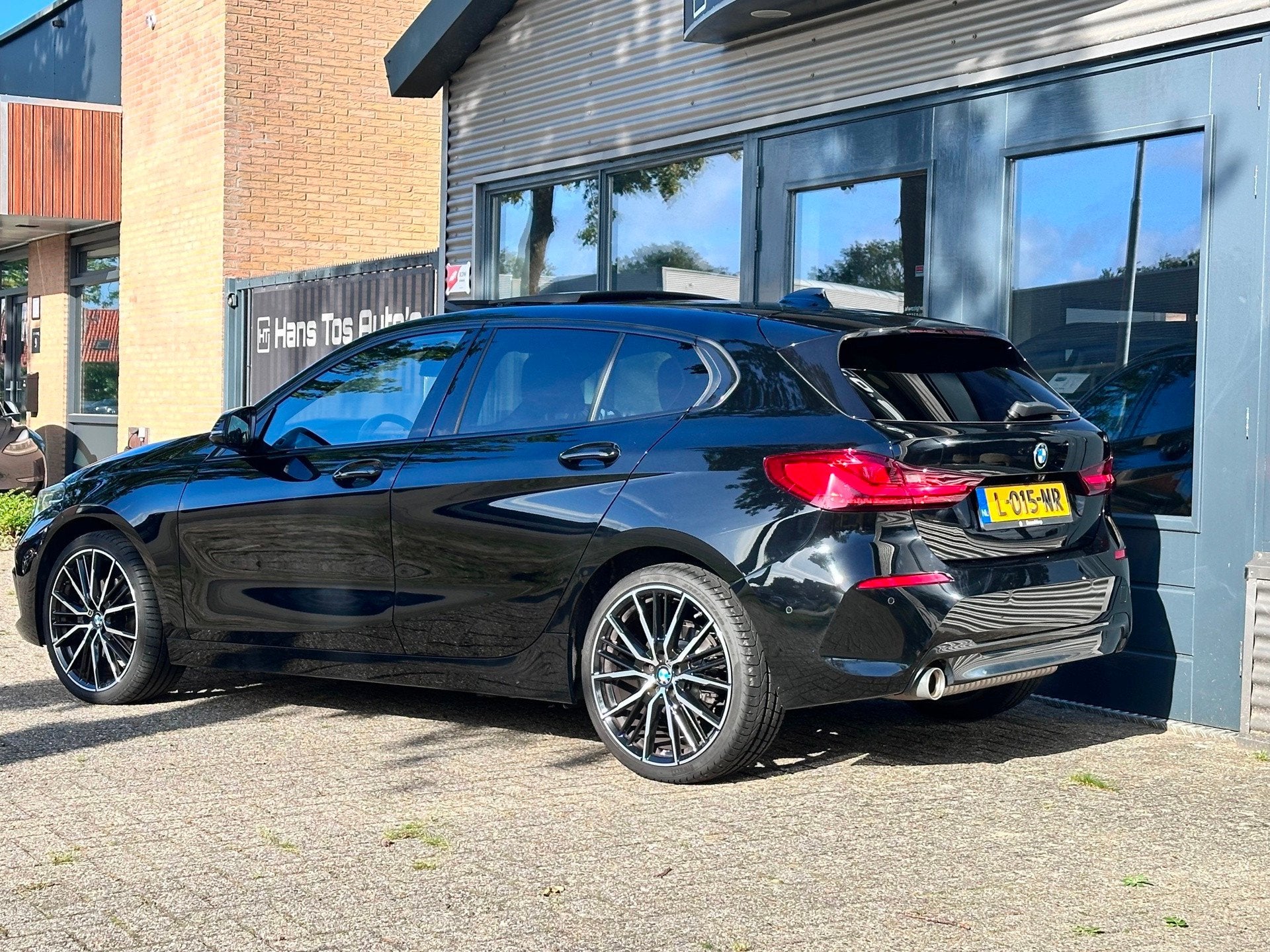 BMW 1-serie 116i AUT Executive Sport Edition/Panorama /Leer, Dealer onderhouden, Gebruikt, Leder en Stof, Zwart