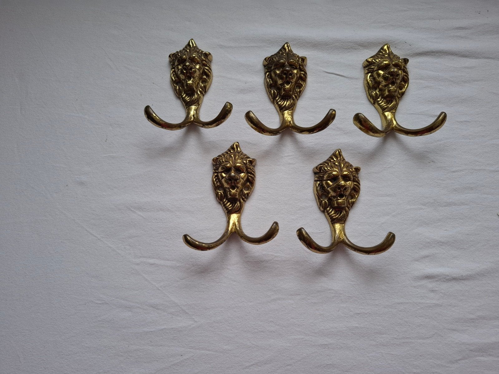 oude koperen kapstokhaken met leeuwenkop, Gebruikt, Wandhaken, Ophalen of Verzenden, Minder dan 100 cm