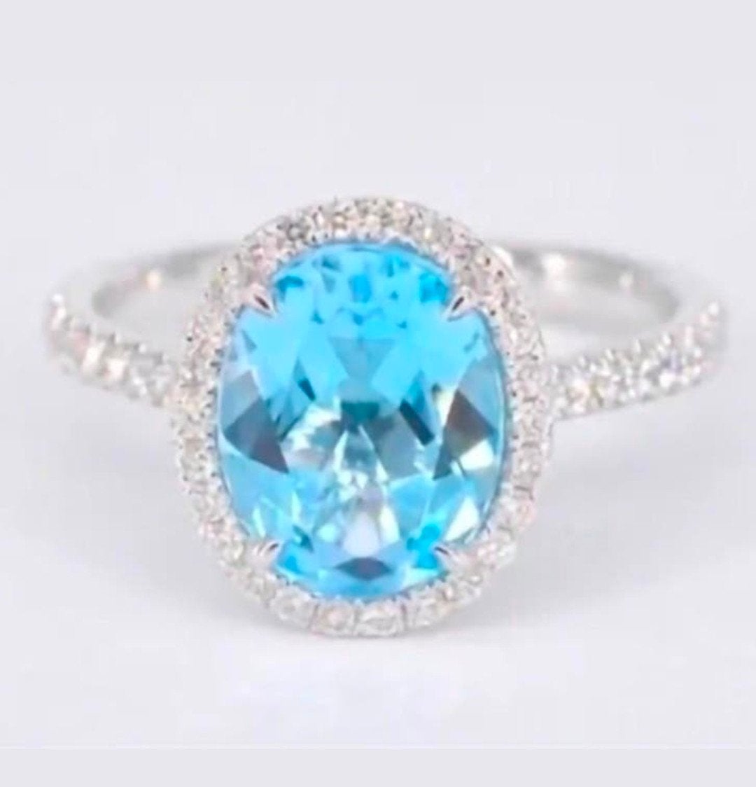 18K Witgouden Ring met Ovaalgeslepen Topaas en Diamanten, Sieraden, Tassen en Uiterlijk, Ringen, Blauw, Nieuw, Ophalen of Verzenden